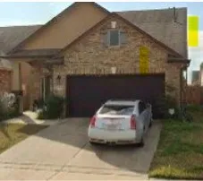 a car parked in front of a house
