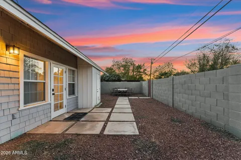 a view of a backyard with a patio