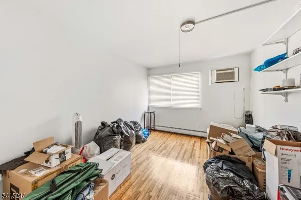 a bed room with a bed and a window
