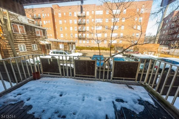 a view of a balcony with chairs
