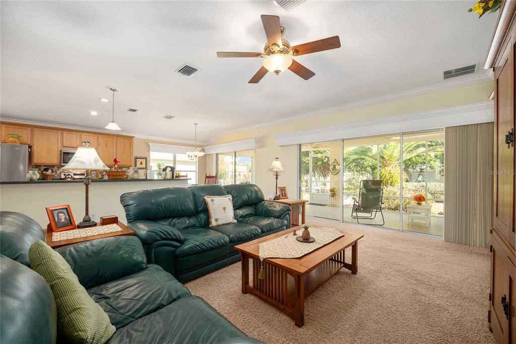 12309 Southeast 92nd Court Road Summerfield, FL 34491 - Photo 12 of 81 a living room with furniture and a large window
