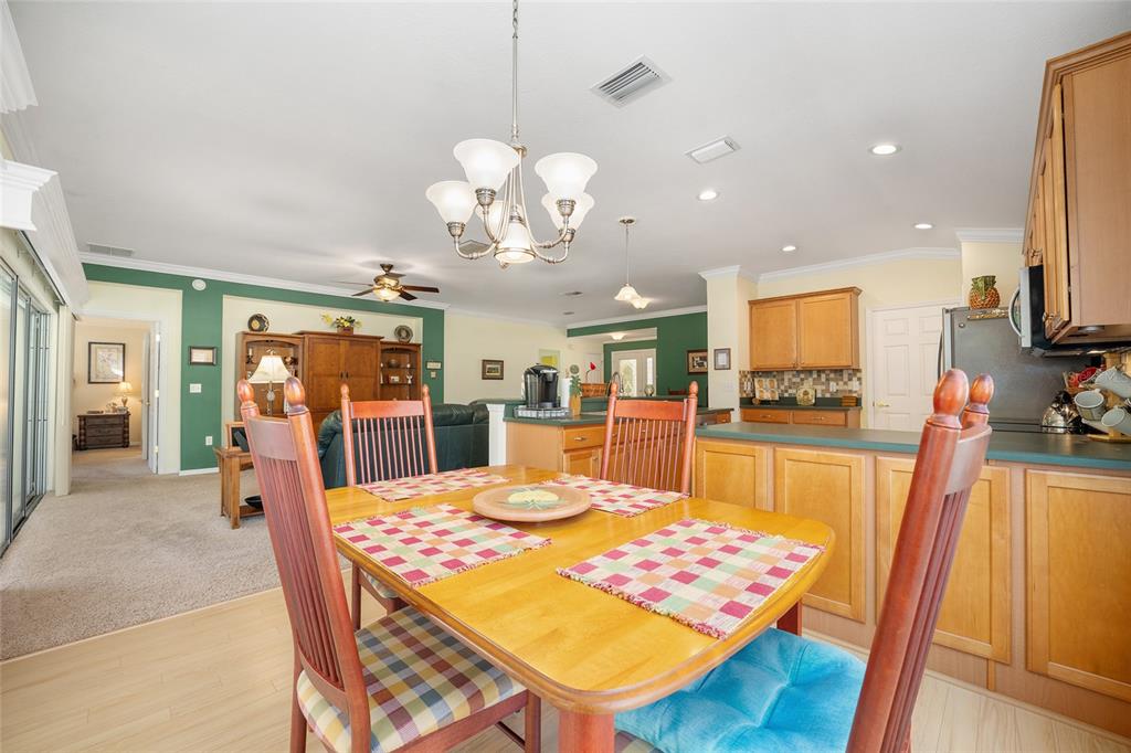 12309 Southeast 92nd Court Road Summerfield, FL 34491 - Photo 18 of 81 a view of a dining room with furniture