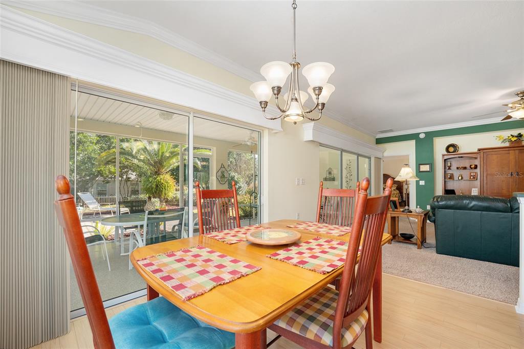 12309 Southeast 92nd Court Road Summerfield, FL 34491 - Photo 19 of 81 a view of a dining room with furniture window and outside view