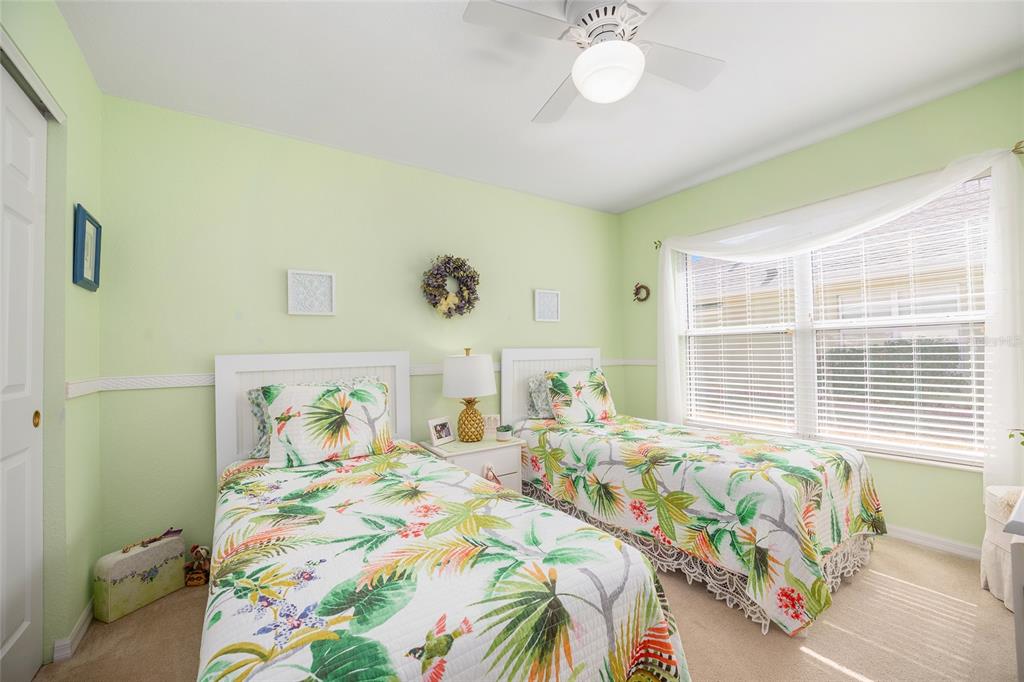12309 Southeast 92nd Court Road Summerfield, FL 34491 - Photo 29 of 81 a bedroom with a bed and a window