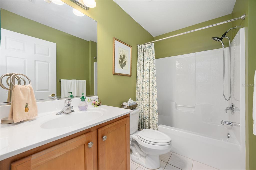 12309 Southeast 92nd Court Road Summerfield, FL 34491 - Photo 31 of 81 a bathroom with a sink a toilet and shower