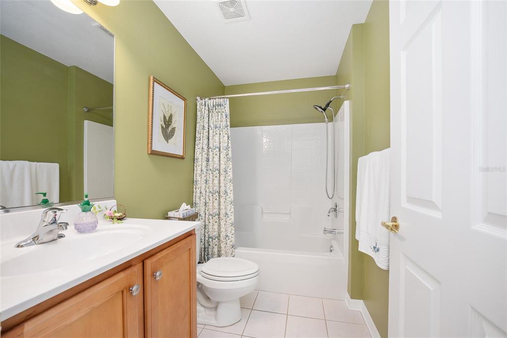 12309 Southeast 92nd Court Road Summerfield, FL 34491 - Photo 32 of 81 a bathroom with a sink a toilet and shower