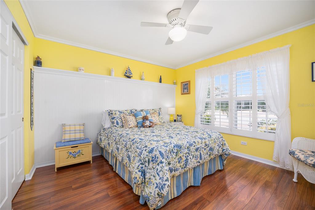 12309 Southeast 92nd Court Road Summerfield, FL 34491 - Photo 34 of 81 a bedroom with a bed and wooden floor