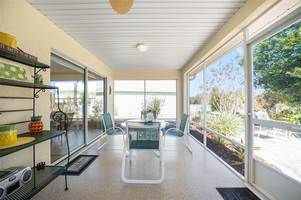 12309 Southeast 92nd Court Road Summerfield, FL 34491 - Photo 44 of 81 a dining room with furniture water view and a large window