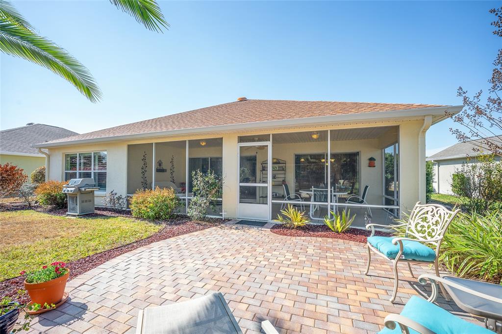 12309 Southeast 92nd Court Road Summerfield, FL 34491 - Photo 54 of 81 a view of a house with sitting area and garden