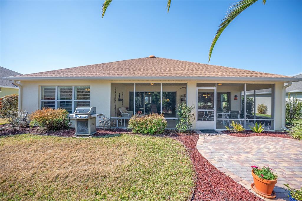 12309 Southeast 92nd Court Road Summerfield, FL 34491 - Photo 55 of 81 a house view with a seating space and garden space