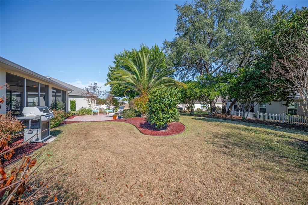12309 Southeast 92nd Court Road Summerfield, FL 34491 - Photo 59 of 81 a view of a house with backyard and sitting area