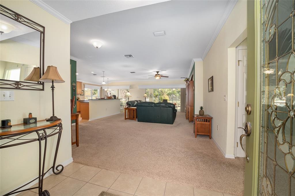 12309 Southeast 92nd Court Road Summerfield, FL 34491 - Photo 6 of 81 a open kitchen with cabinets and a refrigerator