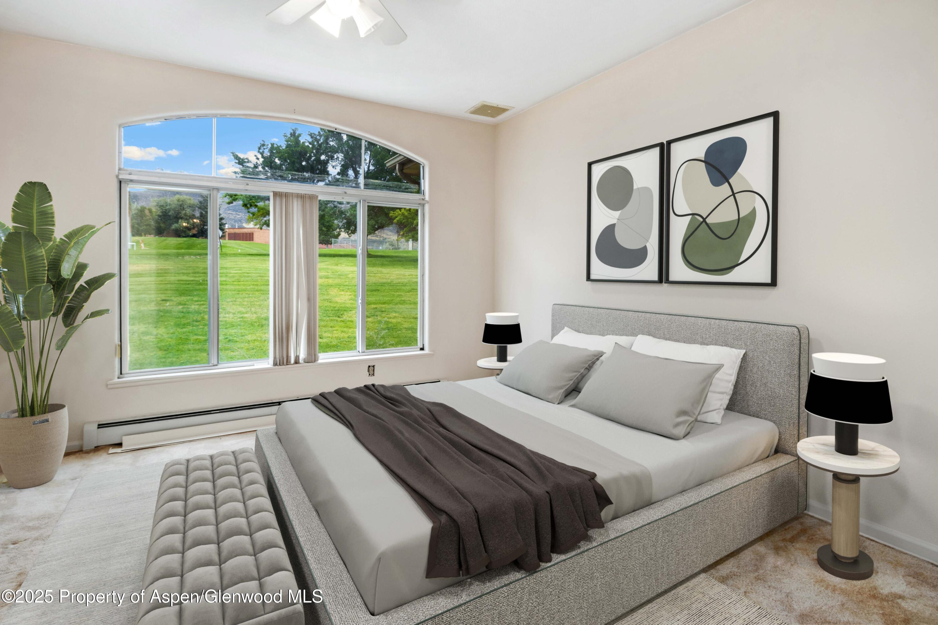 62 Limberpine Circle Parachute, CO 81635 - Photo 11 of 26 a bedroom with a large bed and a window