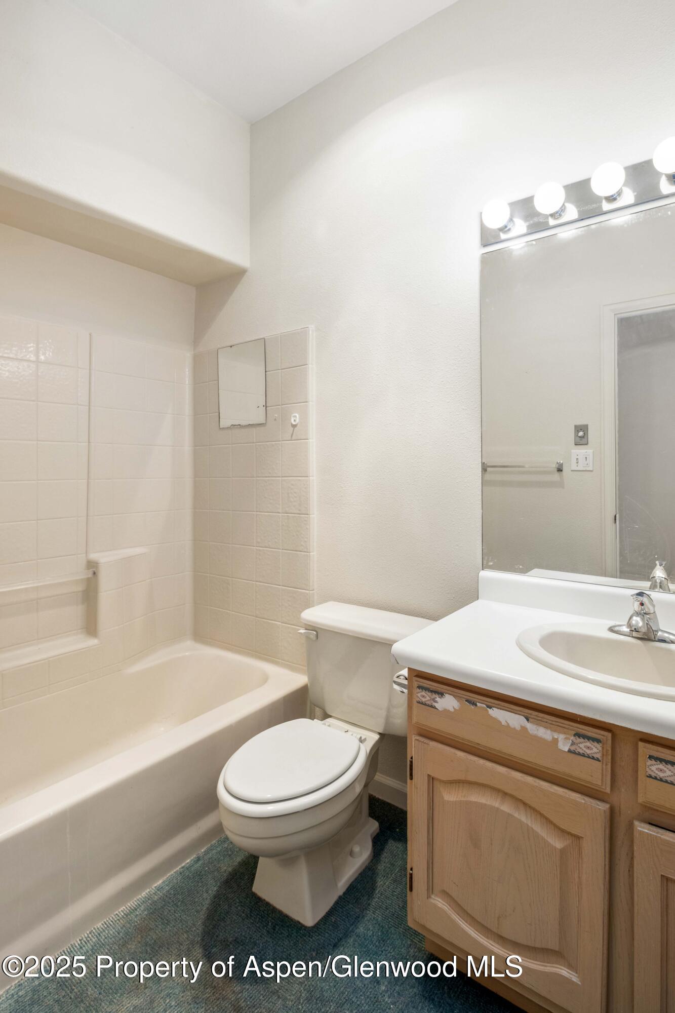 62 Limberpine Circle Parachute, CO 81635 - Photo 13 of 26 a bathroom with a sink a toilet and bathtub