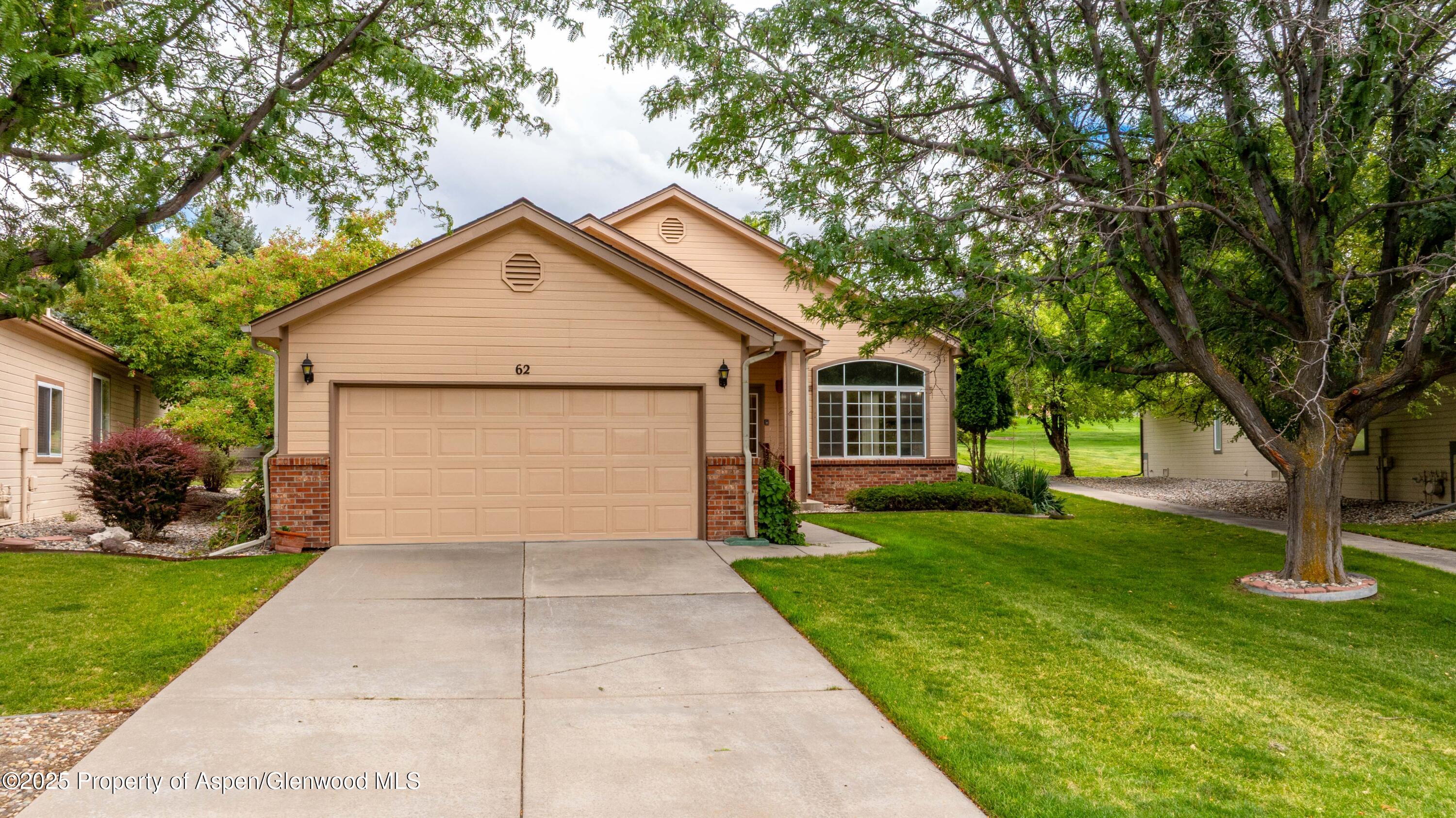 62 Limberpine Circle Parachute, CO 81635 - Photo 15 of 26 a front view of a house with a yard and garage