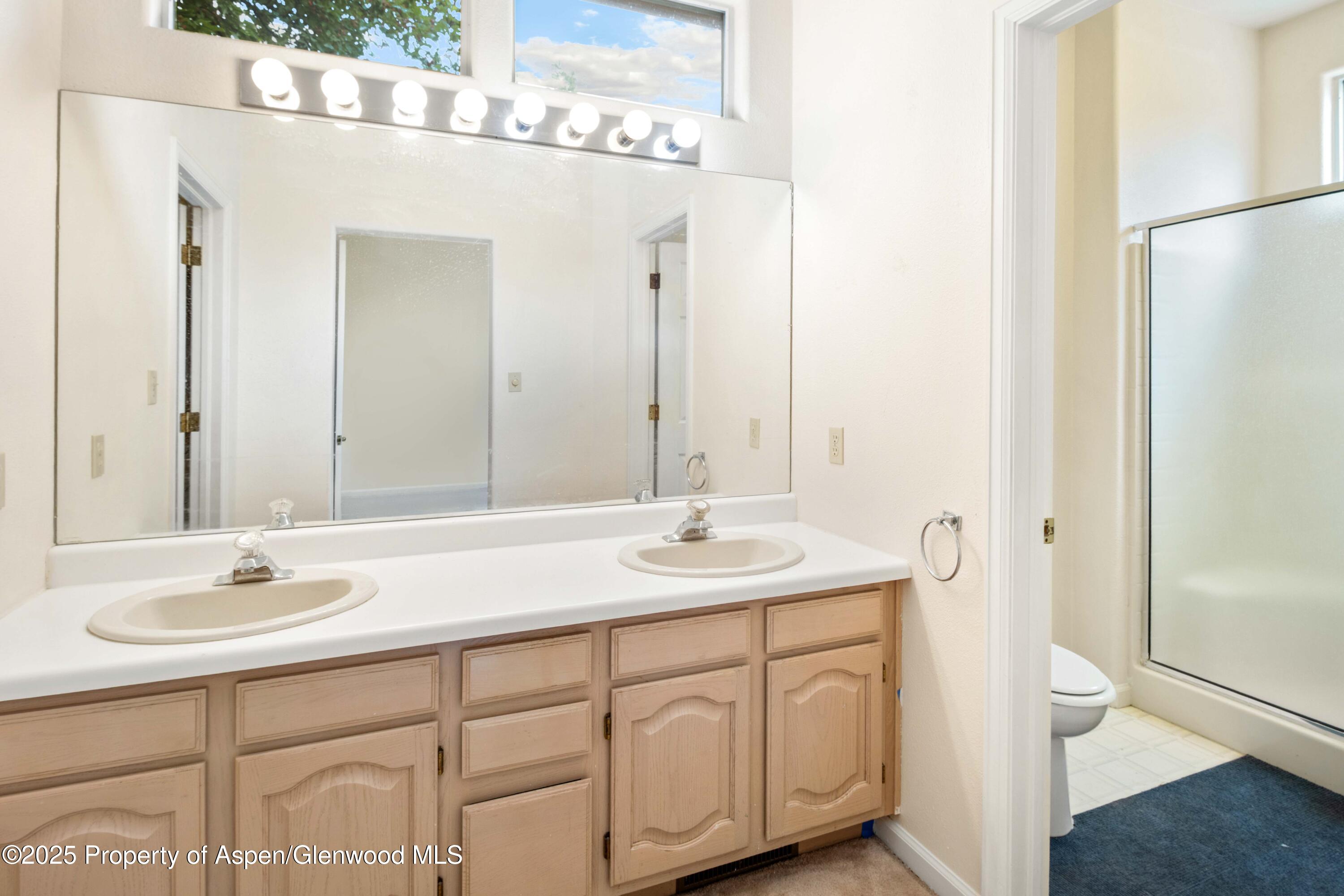62 Limberpine Circle Parachute, CO 81635 - Photo 25 of 26 a bathroom with a sink and a mirror