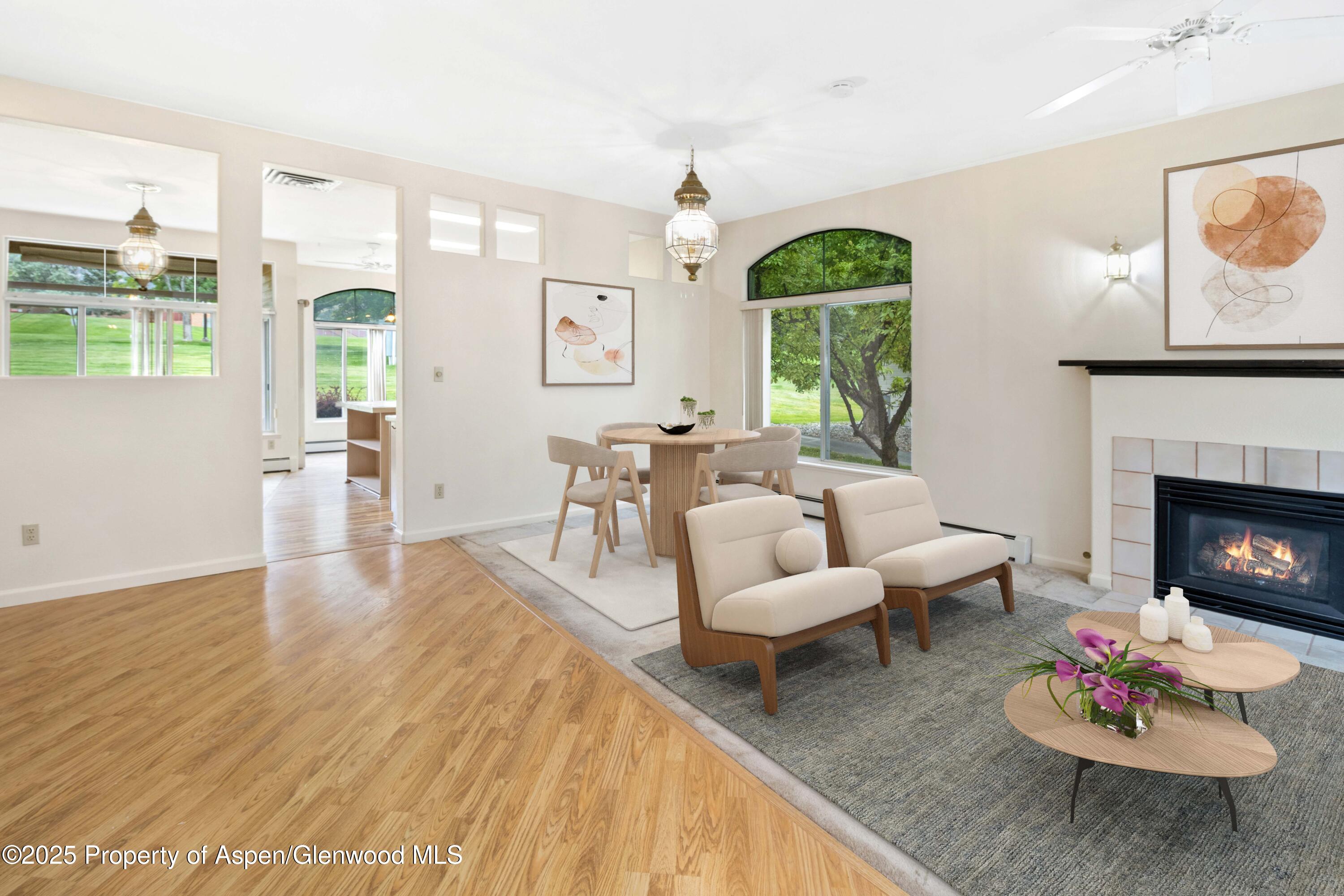 62 Limberpine Circle Parachute, CO 81635 - Photo 4 of 26 a living room with furniture fireplace and a large window