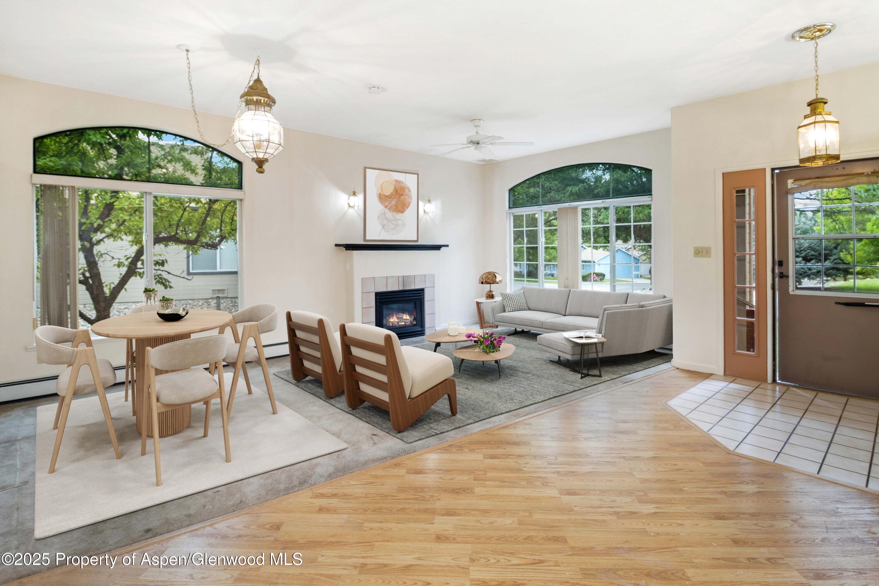 62 Limberpine Circle Parachute, CO 81635 - Photo 5 of 26 a living room with furniture a fireplace and a table