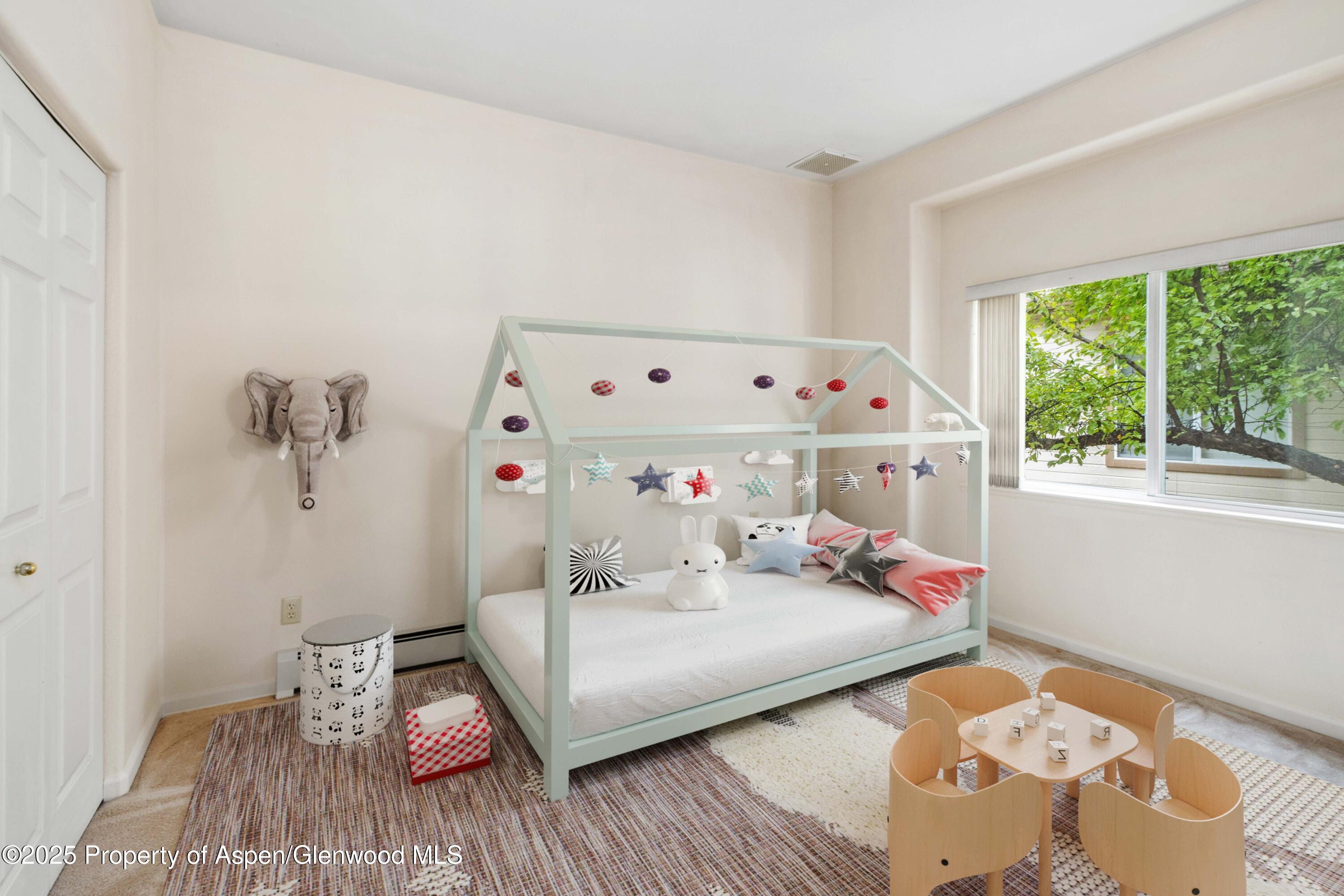 62 Limberpine Circle Parachute, CO 81635 - Photo 10 of 26 a bedroom with a bed and a window
