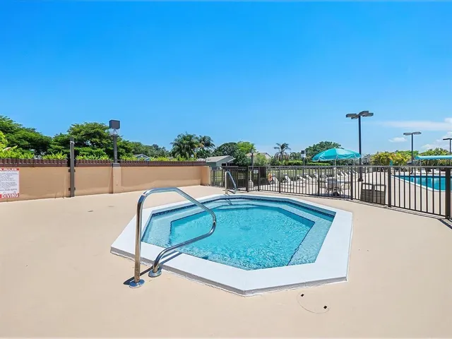 a view of a swimming pool with a lounge chair