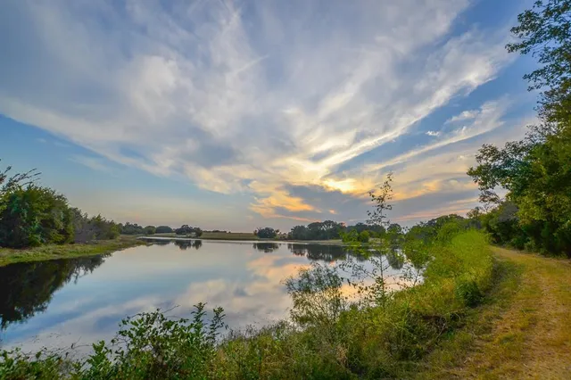 a view of lake with green space