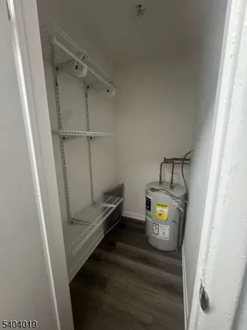 a view of storage and utility room with washer and dryer