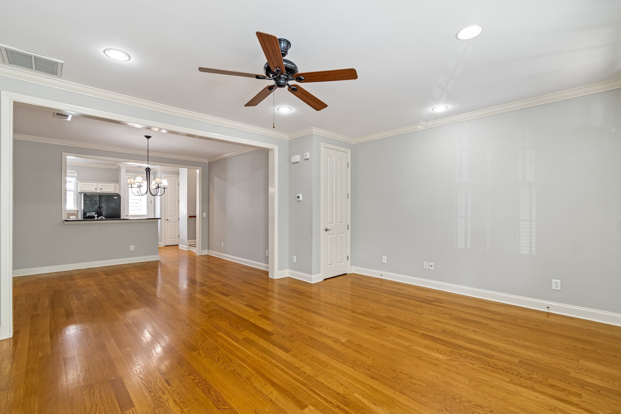 318 Byron Way Franklin, TN 37064 - Photo 8 of 53 a view of empty room with wooden floor and fan