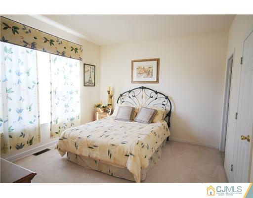 11 Gramercy Road Monmouth Junction, NJ 08852 - Photo 12 of 25 a bedroom with a bed and a window