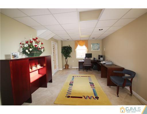 11 Gramercy Road Monmouth Junction, NJ 08852 - Photo 13 of 25 a living room with furniture and a flat screen tv