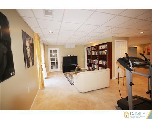11 Gramercy Road Monmouth Junction, NJ 08852 - Photo 14 of 25 a living room with furniture and a flat screen tv