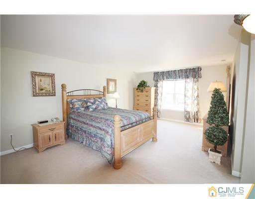 11 Gramercy Road Monmouth Junction, NJ 08852 - Photo 18 of 25 a bedroom with a bed and a large window