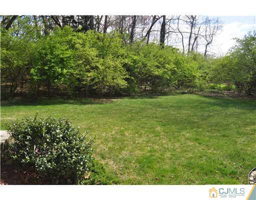 11 Gramercy Road Monmouth Junction, NJ 08852 - Photo 3 of 25 a view of a field of grass and trees