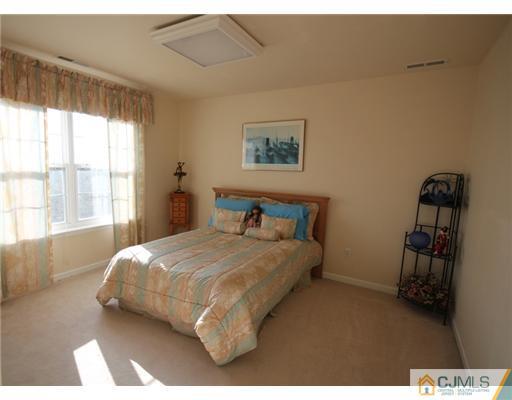 11 Gramercy Road Monmouth Junction, NJ 08852 - Photo 21 of 25 a bedroom with a bed and a window