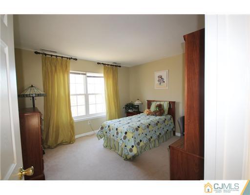 11 Gramercy Road Monmouth Junction, NJ 08852 - Photo 22 of 25 a bedroom with furniture and a window