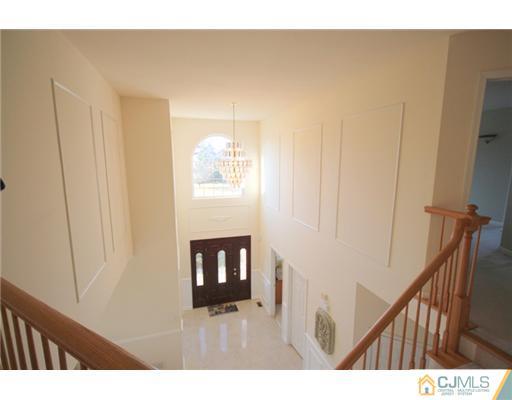 11 Gramercy Road Monmouth Junction, NJ 08852 - Photo 6 of 25 a living room with furniture and a fireplace