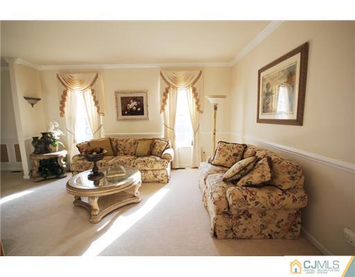 11 Gramercy Road Monmouth Junction, NJ 08852 - Photo 8 of 25 a living room with furniture and a wooden floor