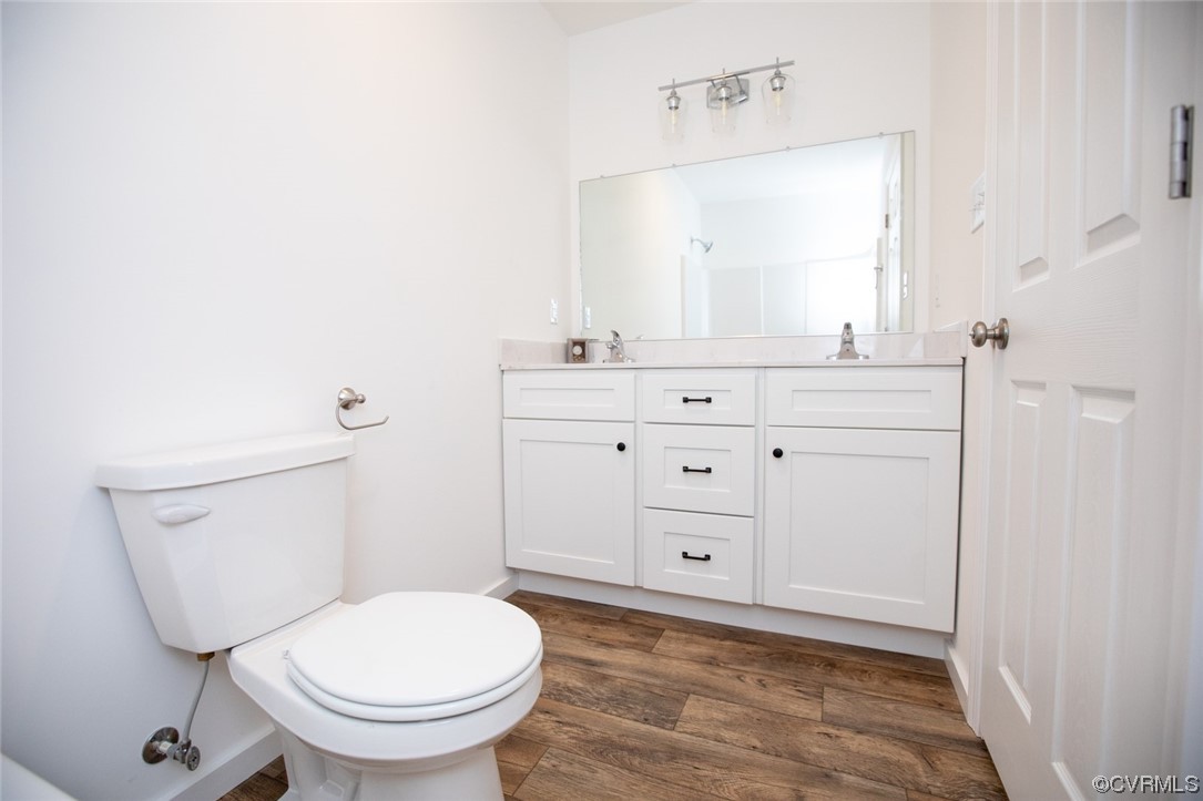 22 Abrams Road Farmville, VA 23901 - Photo 29 of 42 a bathroom with a toilet a sink a vanity and mirror