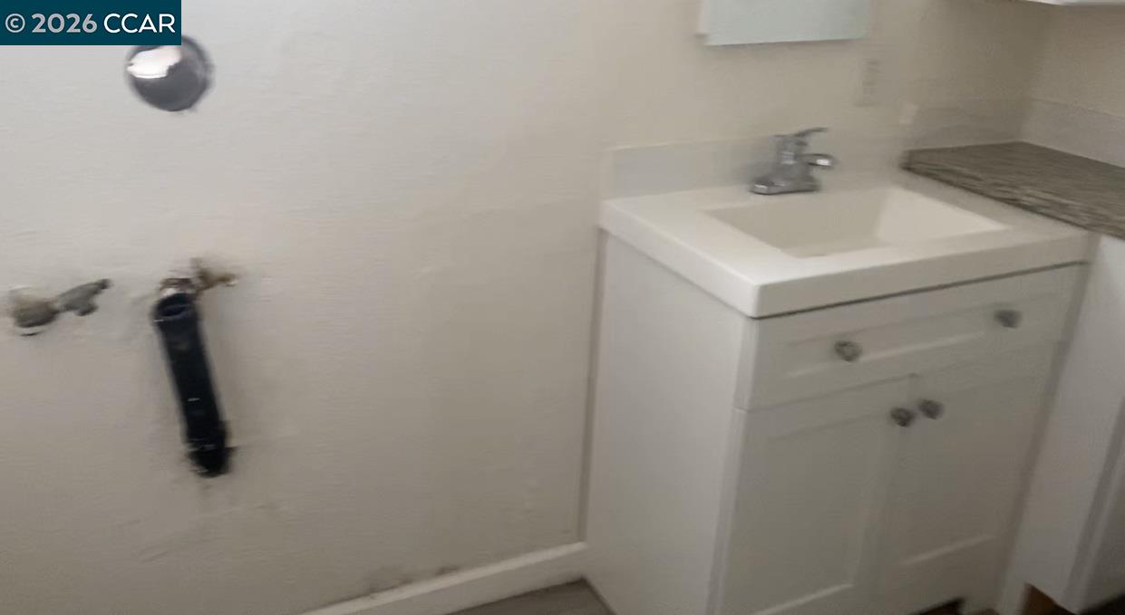 809 West 2nd Street Antioch, CA 94509 - Photo 18 of 18 a bathroom with a sink and mirror