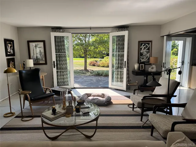 a dining table with chairs and window