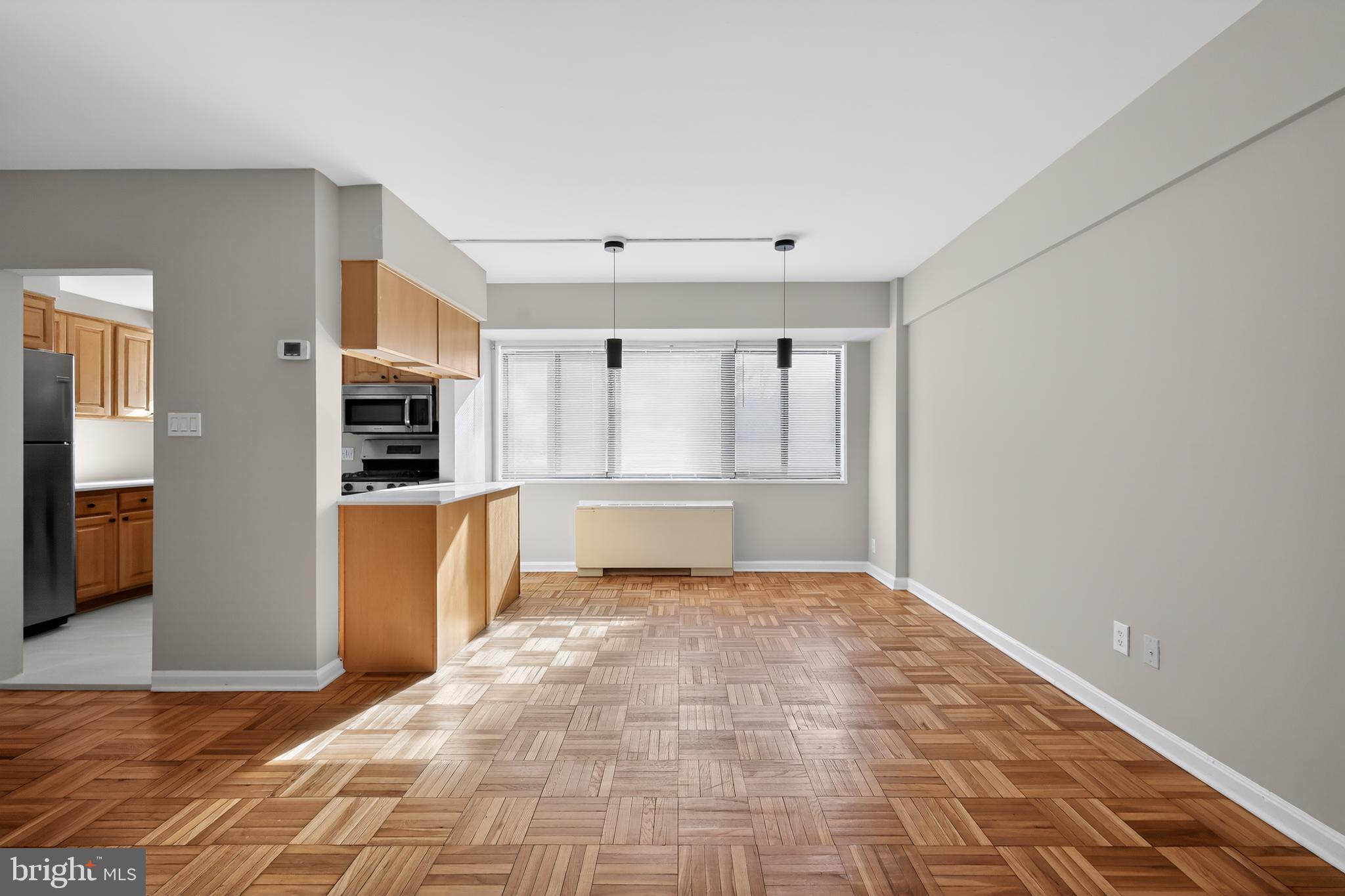 3701 Connecticut Avenue Northwest, Unit 233 Washington, DC 20008 - Photo 21 of 31 a view of a kitchen with wooden floor and a kitchen
