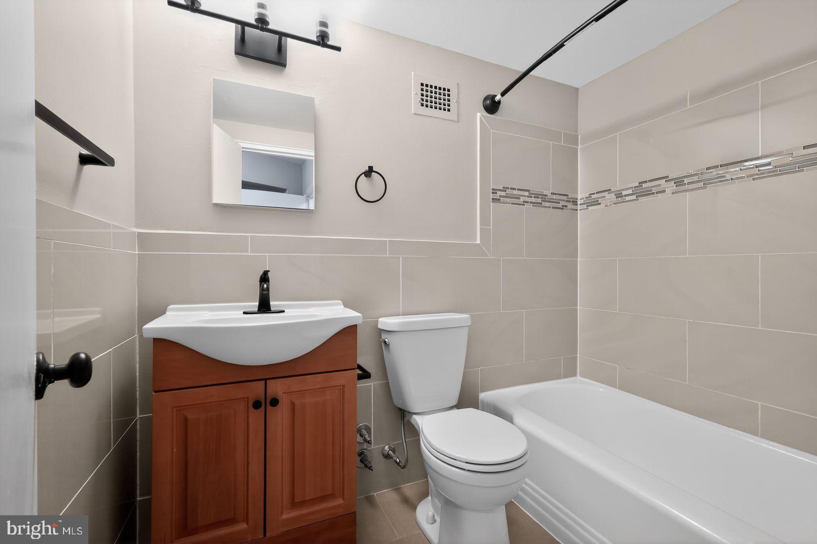 3701 Connecticut Avenue Northwest, Unit 233 Washington, DC 20008 - Photo 29 of 31 a bathroom with a sink toilet and shower