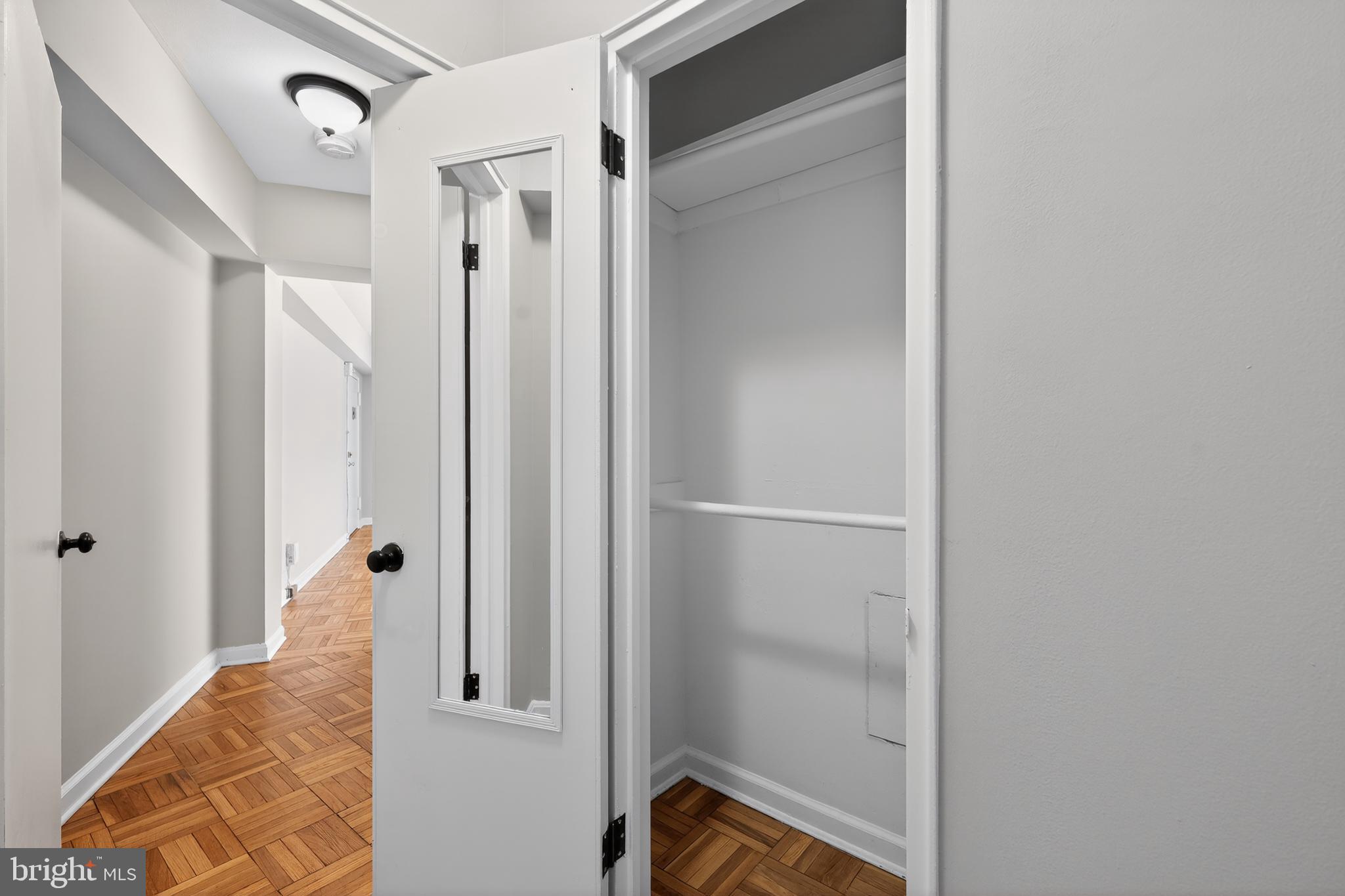 3701 Connecticut Avenue Northwest, Unit 233 Washington, DC 20008 - Photo 30 of 31 a view of a hallway with closet and a fireplace