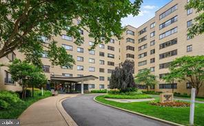 3701 Connecticut Avenue Northwest, Unit 233 Washington, DC 20008 - Photo 3 of 31 a large building with a trees in front of it