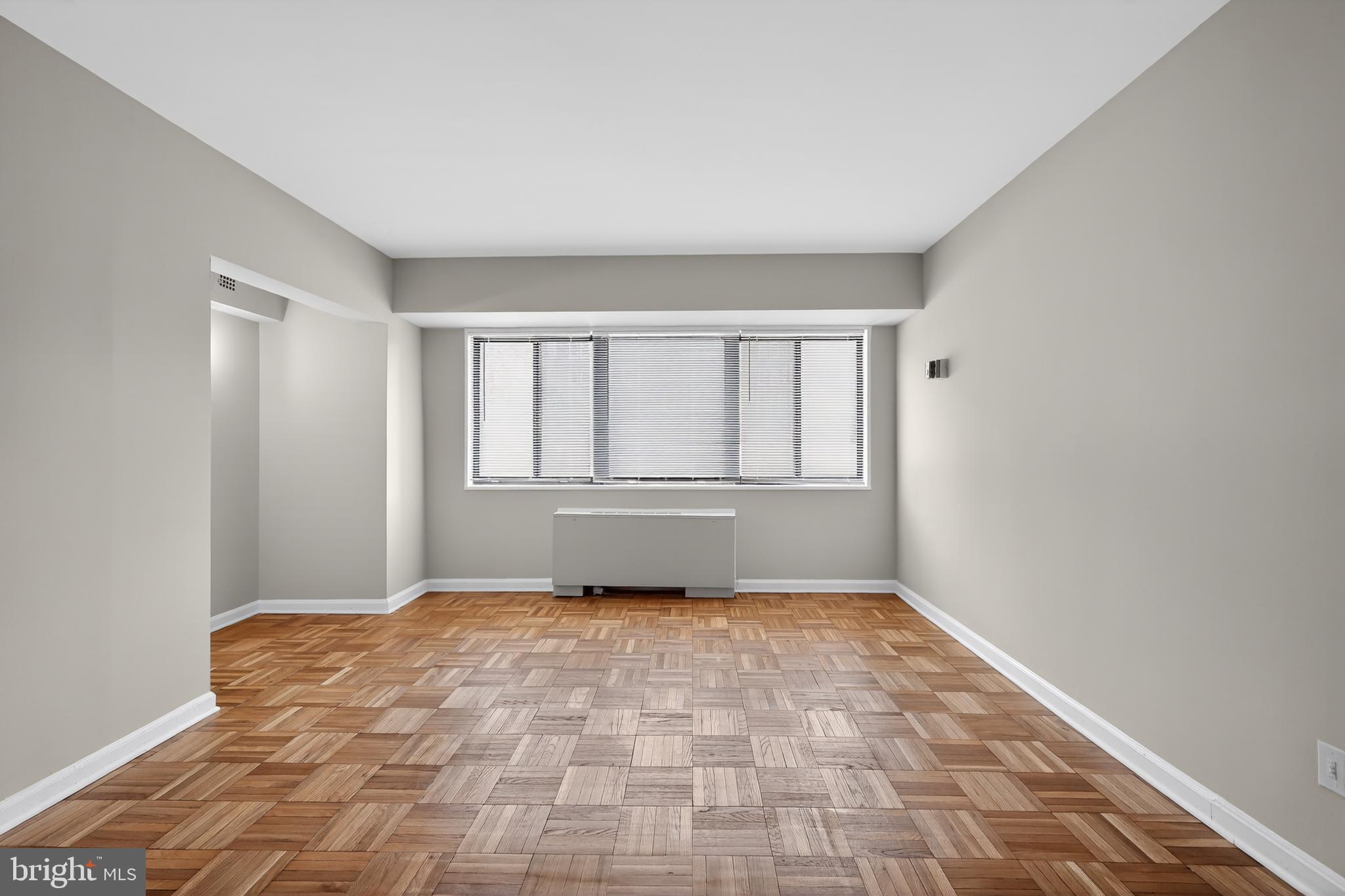 3701 Connecticut Avenue Northwest, Unit 233 Washington, DC 20008 - Photo 9 of 31 a view of an empty room with a window