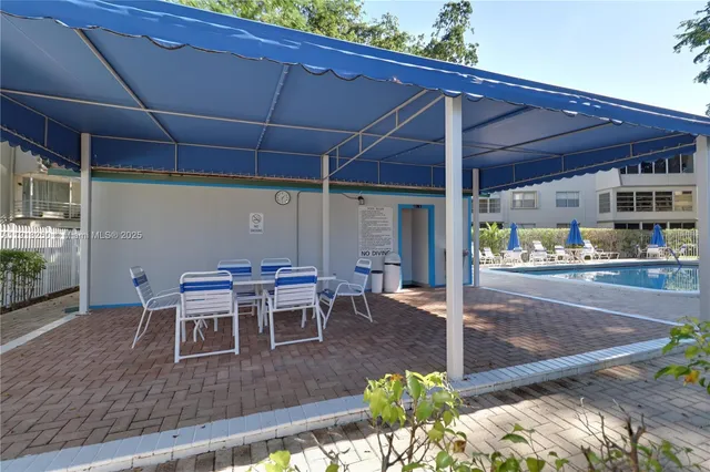 a patio with table and chairs