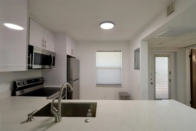 a bedroom with a workspace