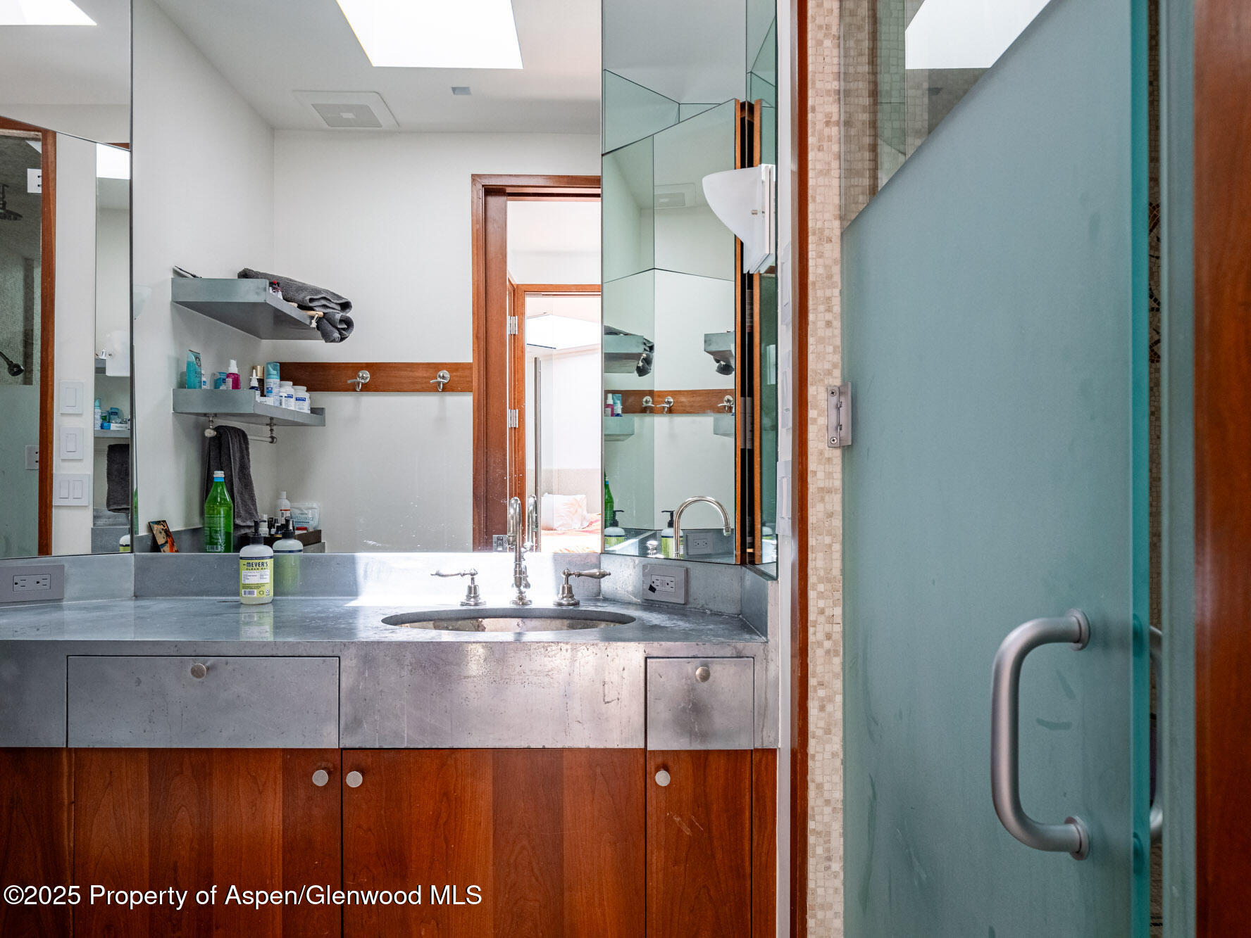 1440 Crystal Lake Road Aspen, CO 81611 - Photo 13 of 44 a bathroom with a granite countertop sink a mirror and shower