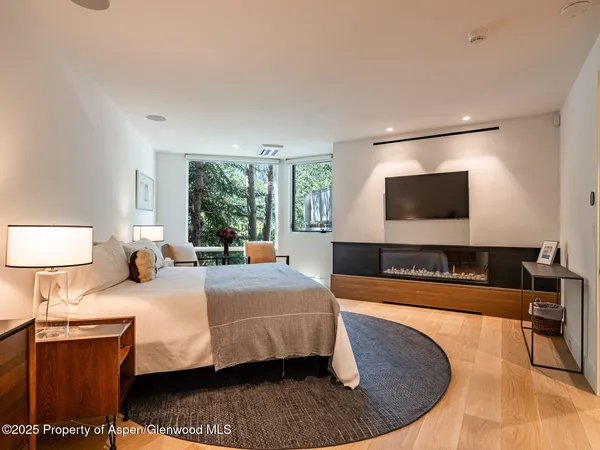 a living room with a window and furniture