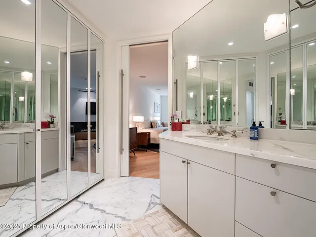 a living room with furniture a rug and a fireplace