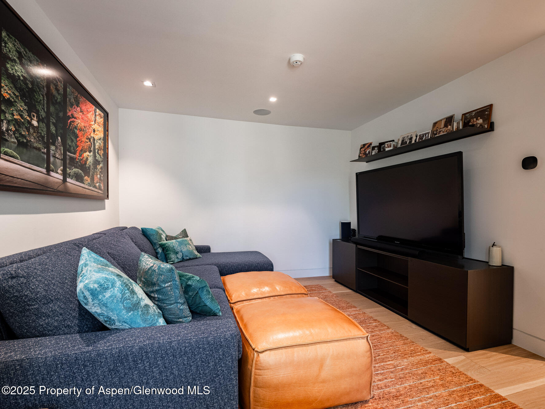1440 Crystal Lake Road Aspen, CO 81611 - Photo 25 of 44 a living room with furniture and a flat screen tv